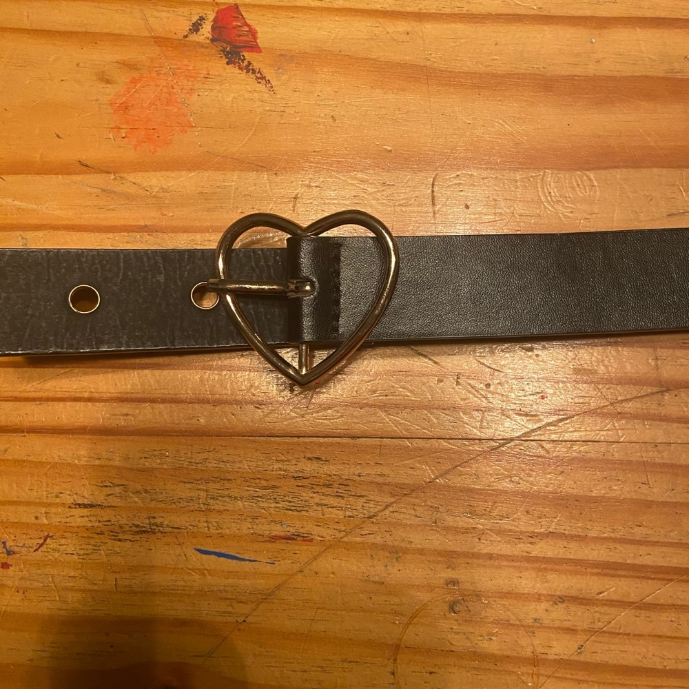 Belt with heart buckle.